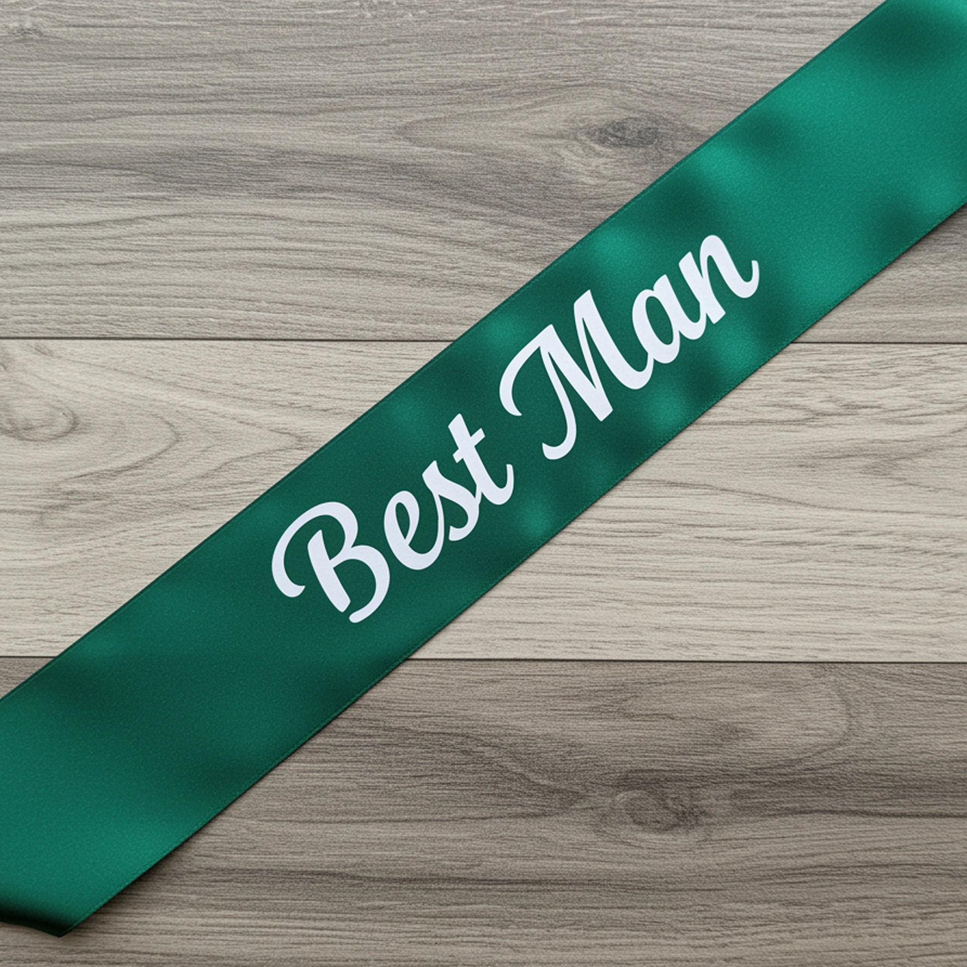 Green sash with 'Best Man' text on a wooden surface